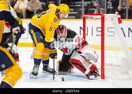 Bridgestone Arena. 13th Feb, 2024. Tennessee, USA; New Jersey Devils goaltender Nico Daws (50) blocks the shot of Nashville Predators center Cody Glass (8) during the first period at Bridgestone Arena. Mandatory Credit: Steve Roberts-USA TODAY Sports. Credit: csm/Alamy Live News Stock Photo