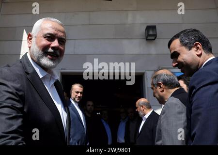 Doha, Qatar. 13th Feb, 2024. Hamas political bureau chief ISMAIL HANIYEH (L) preparing to welcome the Iranian Foreign Minister in Doha. (Credit Image: © Iranian Foreign Ministry via ZUMA Press Wire) EDITORIAL USAGE ONLY! Not for Commercial USAGE! Stock Photo