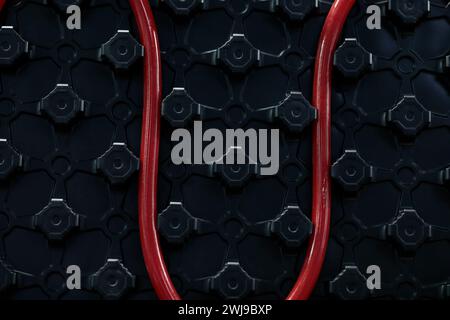 Closeup of warm water underfloor heating system. Selective focus. Stock Photo