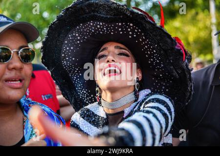 Barranquilla, Colombia. 13th Feb, 2024. The queen of the Carnival of Barranquilla is crying for Joselito during the last day of Carnival On the last day of the Barranquilla Carnival, Joseilito, the soul of the Carnival die. The parade is made by Queen of the Carnival and citizens, who organized in different groups are performing the Joselito funeral and his widows, carries Joselito's coffins and crying for him during the parade. Credit: SOPA Images Limited/Alamy Live News Stock Photo