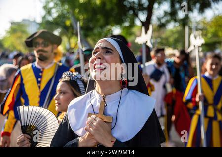 Barranquilla, Colombia. 13th Feb, 2024. A woman dressed as a nun is crying for Joselito. On the last day of the Barranquilla Carnival, Joseilito, the soul of the Carnival die. The parade is made by Queen of the Carnival and citizens, who organized in different groups are performing the Joselito funeral and his widows, carries Joselito's coffins and crying for him during the parade. (Photo by Antonio Cascio/SOPA Images/Sipa USA) Credit: Sipa USA/Alamy Live News Stock Photo