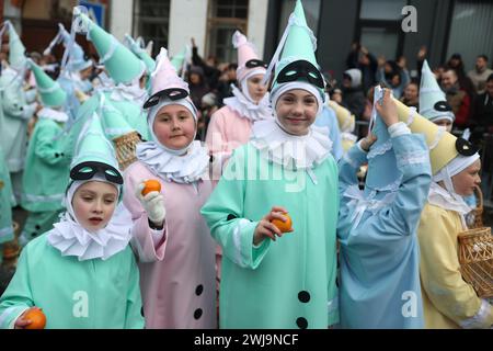 Binche, Belgium. 13th Feb, 2024. Children wearing costumes of 'Pierrot' attend the parade of Shrove Tuesday, the last day of Carnival in Binche, Belgium, Feb. 13, 2024. Binche's three-day carnival, a UNESCO World Heritage event and one of the most famous carnivals in Europe, reached its climax on Tuesday. Credit: Zhao Dingzhe/Xinhua/Alamy Live News Stock Photo