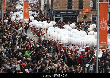 Binche, Belgium. 13th Feb, 2024. People attend the parade of Shrove Tuesday, the last day of Carnival, in Binche, Belgium, Feb. 13, 2024. Binche's three-day carnival, a UNESCO World Heritage event and one of the most famous carnivals in Europe, reached its climax on Tuesday. Credit: Zhao Dingzhe/Xinhua/Alamy Live News Stock Photo