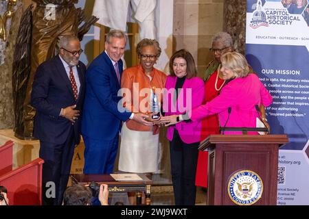 Washington, District Of Columbia, USA. 13th Feb, 2024. From left, U.S. Rep. Troy Carter (D-LA), former House Speaker Kevin McCarthy (R-CA), Clerk Cheryl Johnson, and Speaker Emerita Nancy Pelosi (D-CA) congratulate Johnson as she receives the U.S. Capitol Historical Society's 2023 Freedom Award to recognize her exceptional leadership and pivotal role in preserving and commitment to upholding the American democratic process. (Credit Image: © Eric Kayne/ZUMA Press Wire) EDITORIAL USAGE ONLY! Not for Commercial USAGE! Stock Photo