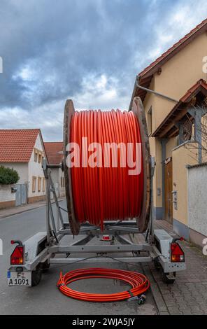 fiber optic cable reel on a roadside trailer Stock Photo