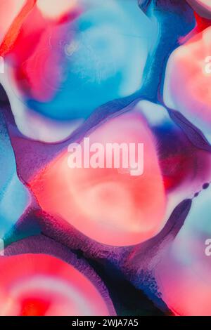 An ethereal mix of vivid colors flows fluidly, resembling a dreamy abstract painting with a captivating blend of pink, blue, and purple hues Stock Photo