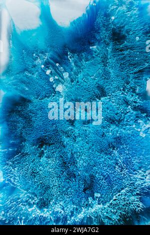 Abstract image displaying vibrant blue and turquoise watercolor textures with dynamic patterns resembling underwater scenes Stock Photo
