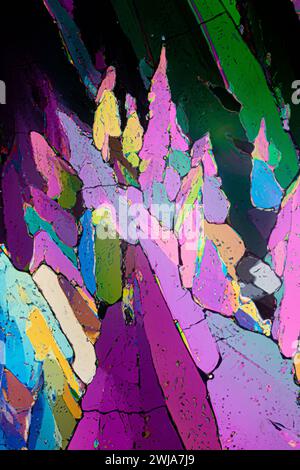 Abstract art-like image of erythritol sugar crystals under a microscope, with a collage of vivid, contrasting colors Stock Photo