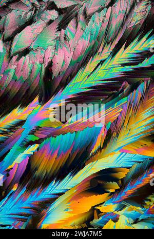 A colorful close-up of crystal magnification showcasing a psychedelic pattern with vibrant hues and intricate details Stock Photo