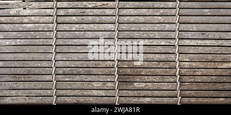 Straw material for floor or wall. Bamboo carpet. Background of bamboo mat texture Stock Photo