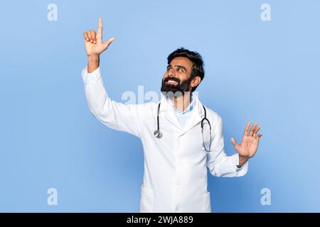 Male doctor touching invisible screen with happy look Stock Photo