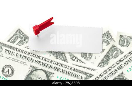 Blank note on a pile of money. Sheet of note paper with push pin on dollars. Cut out and copy space. Paper reminder Stock Photo