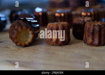Specialty pastries from Bordeaux. Cannelé Bordelais traditional copper mold Stock Photo