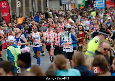 LONDON - APRIL 28: Runners in the London Marathon on April, 28, 2019 in London, UK. The London Marathon is next to New York, Berlin, Chicago and Bosto Stock Photo
