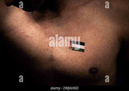 Doha, Qatar. 14th Feb, 2024. Yazan Al Bawwab of Palestine prepares to compete in the swimming men's 50m freestyle preliminary during the 21st World Aquatics Championships at the Aspire Dome in Doha (Qatar), February 14, 2024. Credit: Insidefoto di andrea staccioli/Alamy Live News Stock Photo