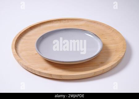 Bamboo wooden plank with empty plate Stock Photo