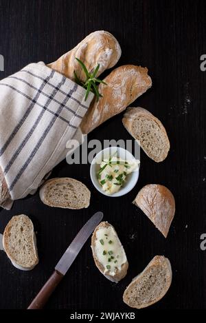 baguette bread loaves in paper bag on wooden background Stock Photo