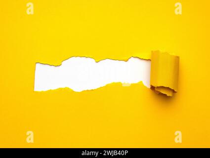 Yellow torn Paper with space for text on white background. Stock Photo