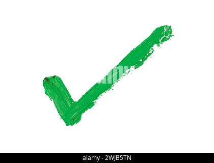 Check mark painted with thick green oil paint on white background with clipping path Stock Photo