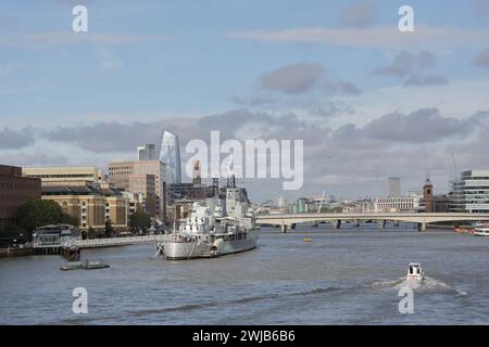 HMS Belfast is a famous museum ship and operated by the Imperial War Museum near the Tower Bridge on River Thames, London, UK Stock Photo