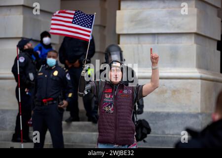 United States. 06th Jan, 2021. A California man, Cameron Charles Clapp, seen here standing outside the U.S. Capitol during the January 6, 2021 insurrection, was arrested in California. Clapp, who lost three of his limbs as a teenager, faces federal charges for entering the U.S. Capitol and for his role in the Jan. 6, 2021, riots in Washington, DC (Photo by Michael Nigro/Pacific Press) Credit: Pacific Press Media Production Corp./Alamy Live News Stock Photo