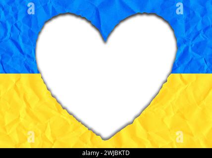 Scrap of paper in the shape of a heart in the colors of the Ukrainian flag, copy space Stock Photo