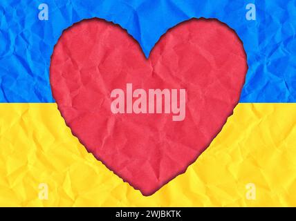 Scrap of paper in the shape of a heart in the colors of the Ukrainian flag, copy space Stock Photo