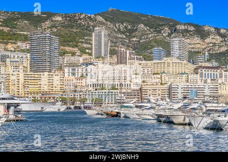 Monte Carlo in Monaco. Tightly packed luxury villas and apartments for the rich and famous. With twisting roads weaving between high rise buildings. Stock Photo