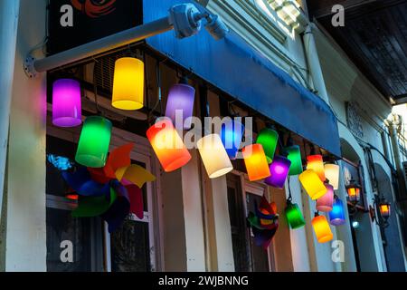 the facade of the cafe is decorated, the entrance is decorated with various chandeliers and floor lamps, colorful light bulbs Stock Photo