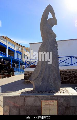 Monumento Al Pescador statue of woman looking out to sea by Paco Curbel. El Cotillo, Fuerteventura, Canary Islands Stock Photo