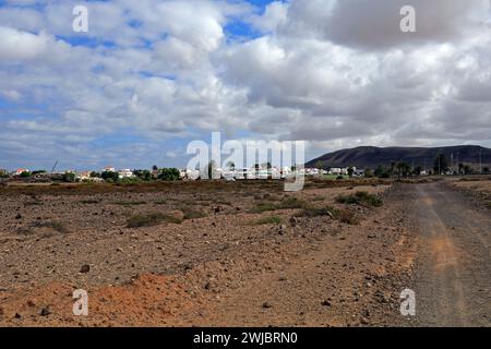 Dusty back road to El Roque village across scrubland from El Cotillo, Fuerteventura taken November 2023 cloudy day Stock Photo