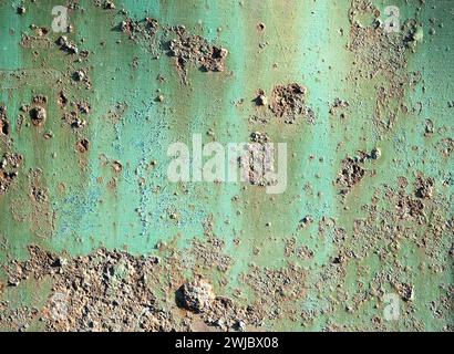 Corroded metal background. Rusted blue painted metal wall. Rusty metal background with streaks of rust. Rust stains. The metal surface rusted spots. R Stock Photo