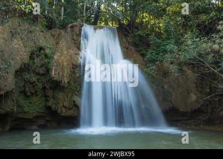 A smaller waterfall on the Limon River near the main waterfalls of El Limon in the  Dominican Republic.  A slow shutter speed was used to give the wat Stock Photo