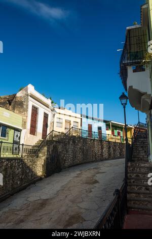 Colorfully painted old houses on Calle Hostos in the Colonial City of Santo Domingo in the Dominican Republic.  A UNESCO World Heritage Site.  This st Stock Photo