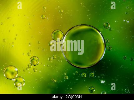Colorful abstract macro background with oil drops in water Stock Photo