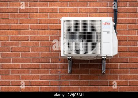 Gothenburg, Sweden - October 12 2022: Fujitsu air condition unit on the wall of a brick building Stock Photo