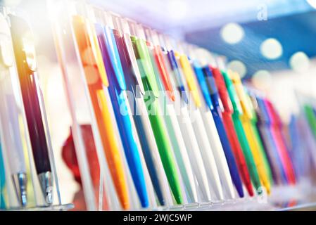 Modern colored plastic ballpoint pens on store display Stock Photo