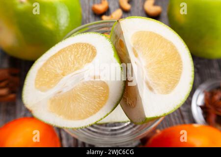 sliced sweetie on wood background Stock Photo