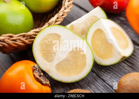 sliced sweetie on wood background Stock Photo