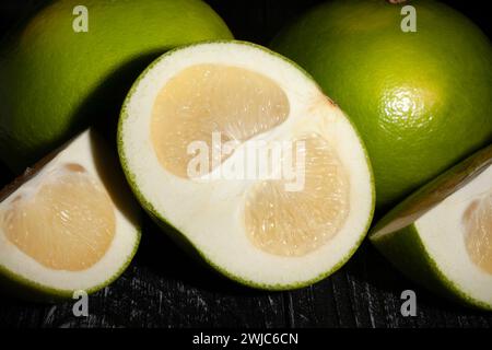 sliced sweetie on wood background Stock Photo