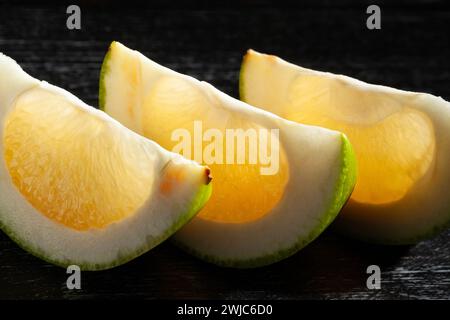 sliced sweetie on black background Stock Photo