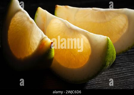 sliced sweetie on black background Stock Photo