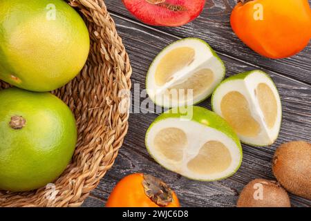 sliced sweetie on wood background top view Stock Photo