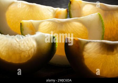 sliced sweetie on black background Stock Photo