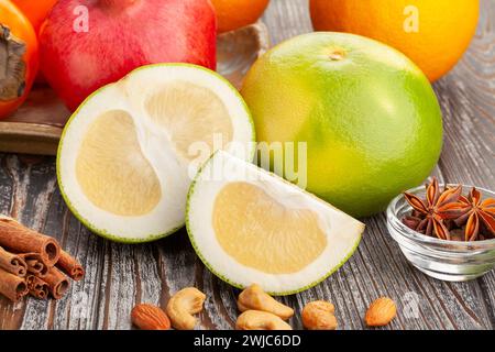 sliced sweetie on wood background Stock Photo