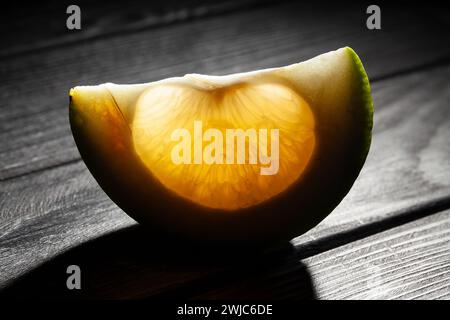 sliced sweetie on wood background Stock Photo