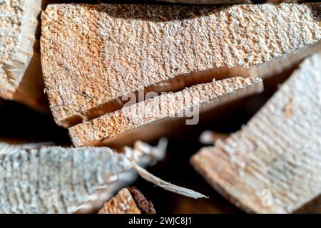 Close-up of freshly cut firewood stacked on top of each other Stock Photo