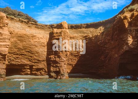 Sandstone cliffs along the shore of Cap aux Meules in the Magdalen Islands, Isles du Madeleine in the Gulf of St Lawrence, Quebec, Canada Stock Photo