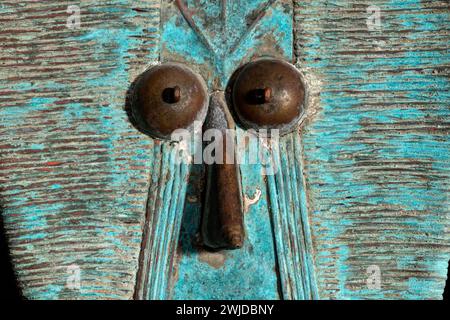 Macro shot of a wooden Kota reliquary figure from Gabon. Tribal African art, showcasing masterful craftsmanship and spiritual symbolism. Stock Photo