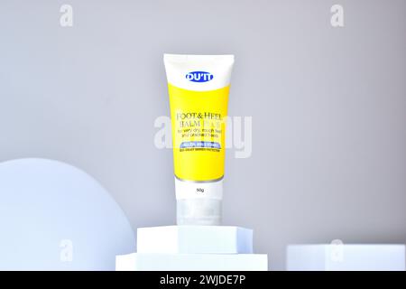 image of a heel cream in a yellow tube with a white bokeh background Stock Photo